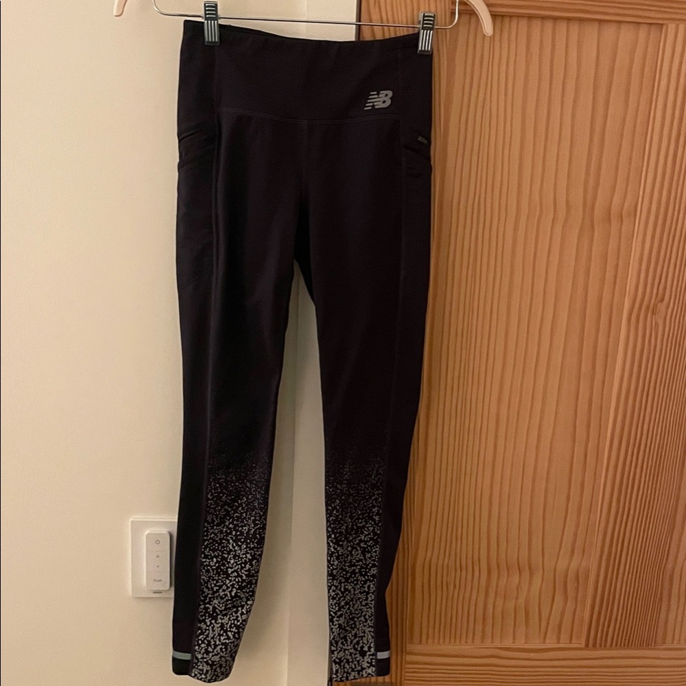 New Balance thermal running tights with reflective pattern